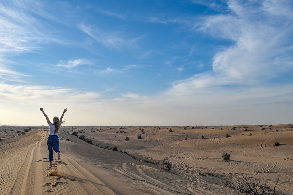 Tourist enjoying at tal moreeb hill at Liwa Desert