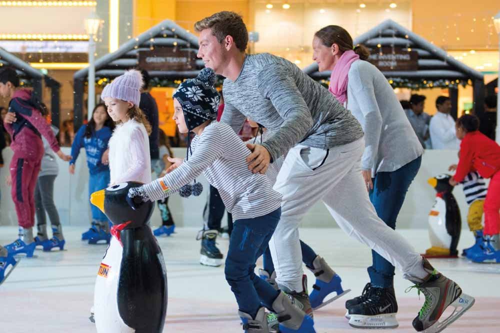 Families enjoying at the Dubai Mall Ice Rink