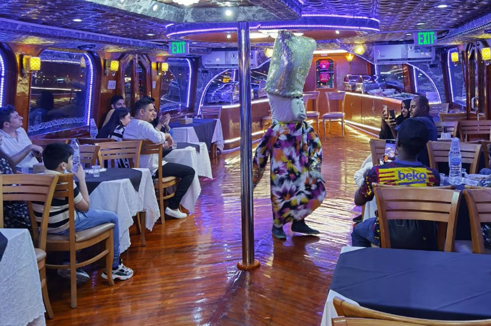 Live entertainment during Dubai Dhow Cruise Creek tour