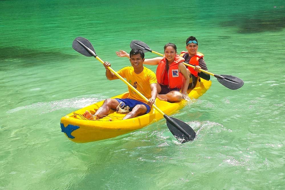 Friends riding the kayak with Kayaking Tour activity in Dubai